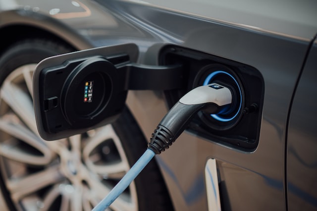 Picture of an electric fuel pump inside the side of an electric vehicle with the side car wheel visible in the left background.