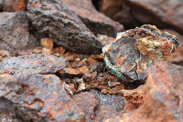 Picture of mineral rocks in a rocky background setting.